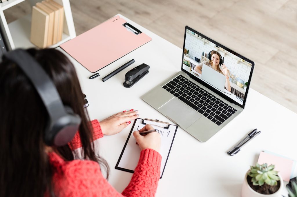 young-latin-woman-in-black-headphones-teaching-english-online.jpg